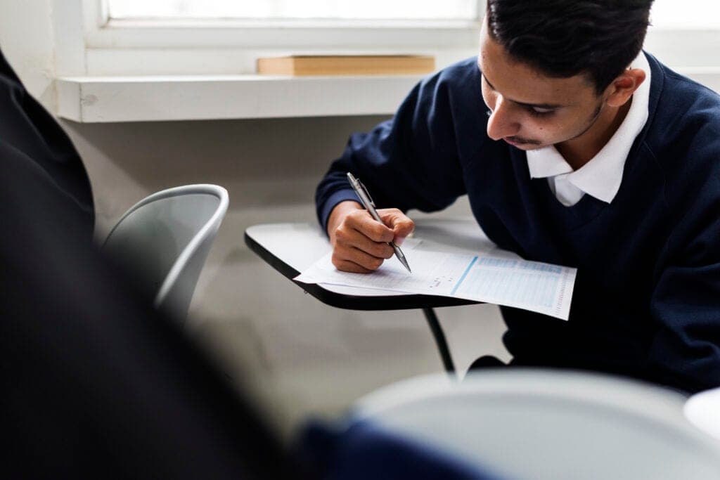 Students in a classroom preparing for international exams